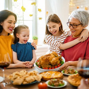 Woman enjoying a hearty meal with her family 