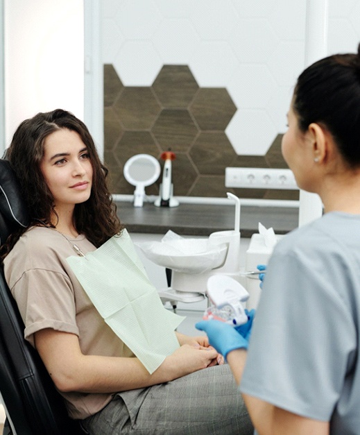 Woman speaking with dentist