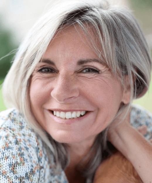 a woman in Columbus smiling with dentures