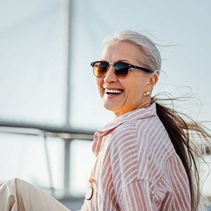 a woman in Columbus smiling with her new dentures