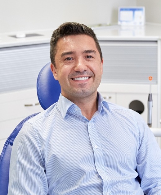 Man sharing healthy smile after dental checkup and teeth cleaning