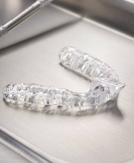 Clear nightguard for bruxism on metal tray