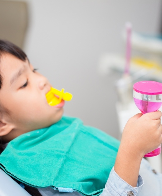 Young patient receiving fluoride treatment