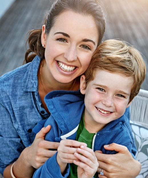 Mother and child smiling after dental sealants treatment