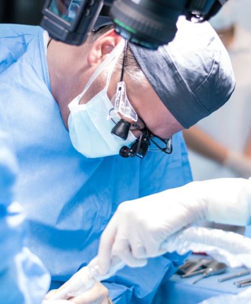 Dental team carefully performing oral surgery