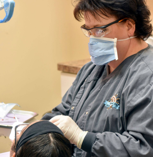 Columbus dental hygienist Karen treating a patient