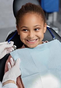Child smiling at the dentist