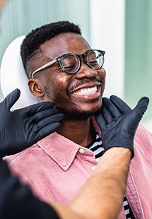 Man smiling at the dentist