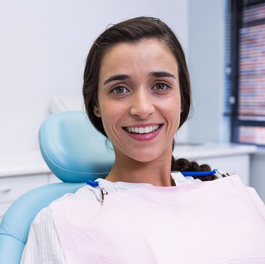 Female dental patient smiling after full mouth reconstruction in Columbus, NJ