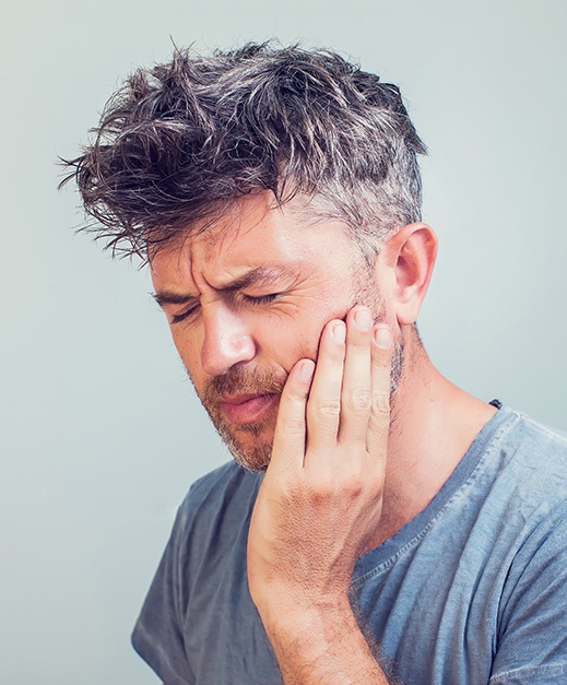 Man experiencing dental pain