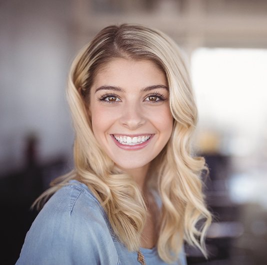 woman smiling after teeth whitening in Columbus