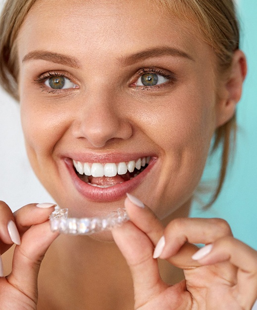 patient using at home whitening tray
