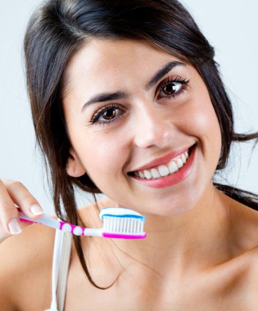 woman brushing teeth