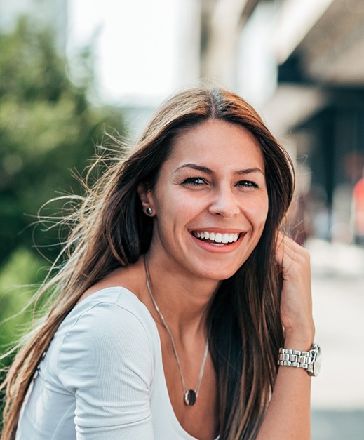 Woman smiling after visiting dentist for teeth whitening in Columbus