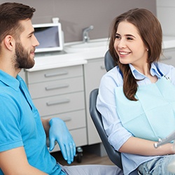 Dentist explaining cost of teeth whitening in Columbus to patient