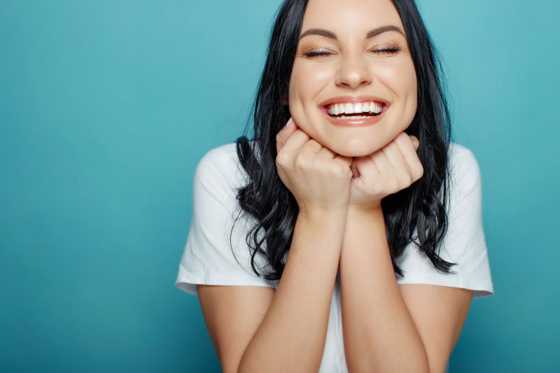 woman smiling after getting teeth whitening in Columbus