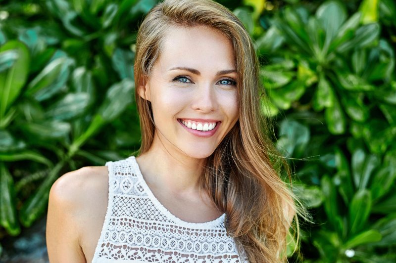 woman smiling about the lifespan of veneers in Columbus