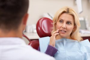 woman talking to her dentist 