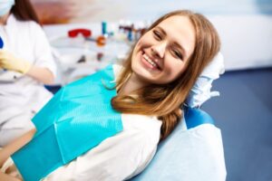 Woman smiling after dental implant placement