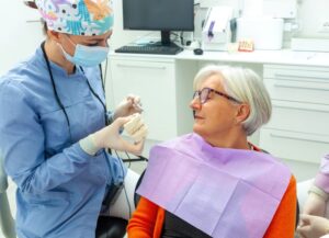 Dentist and patient talking during consultation 